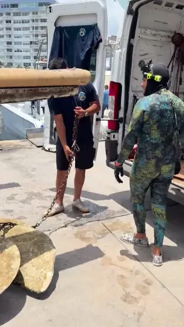 Crew handling a marine propeller video preview